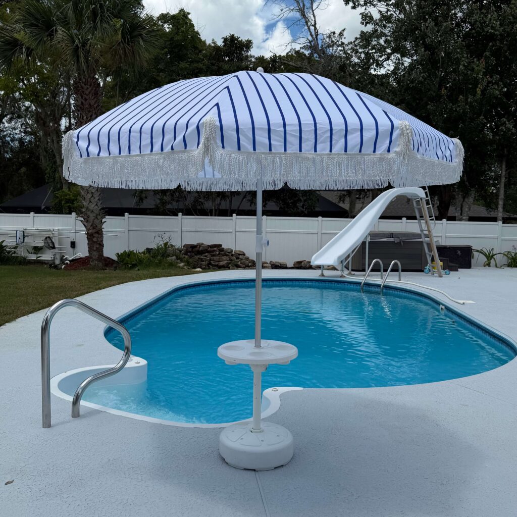 Blue and white umbrella a pictured in a boat table