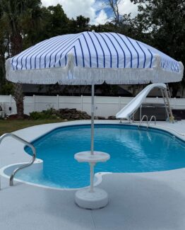 Blue and white umbrella a pictured in a boat table