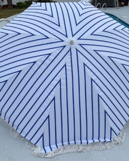 Blue and white tassel umbrella on site