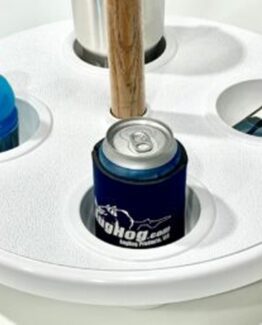 Close-up of a blue can in a white circular beverage holder, with an orange-capped bottle in a neighboring slot and sunglasses nearby.