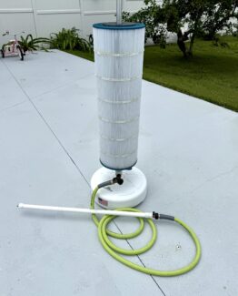 Picture of the best pool filter cleaner on concrete patio