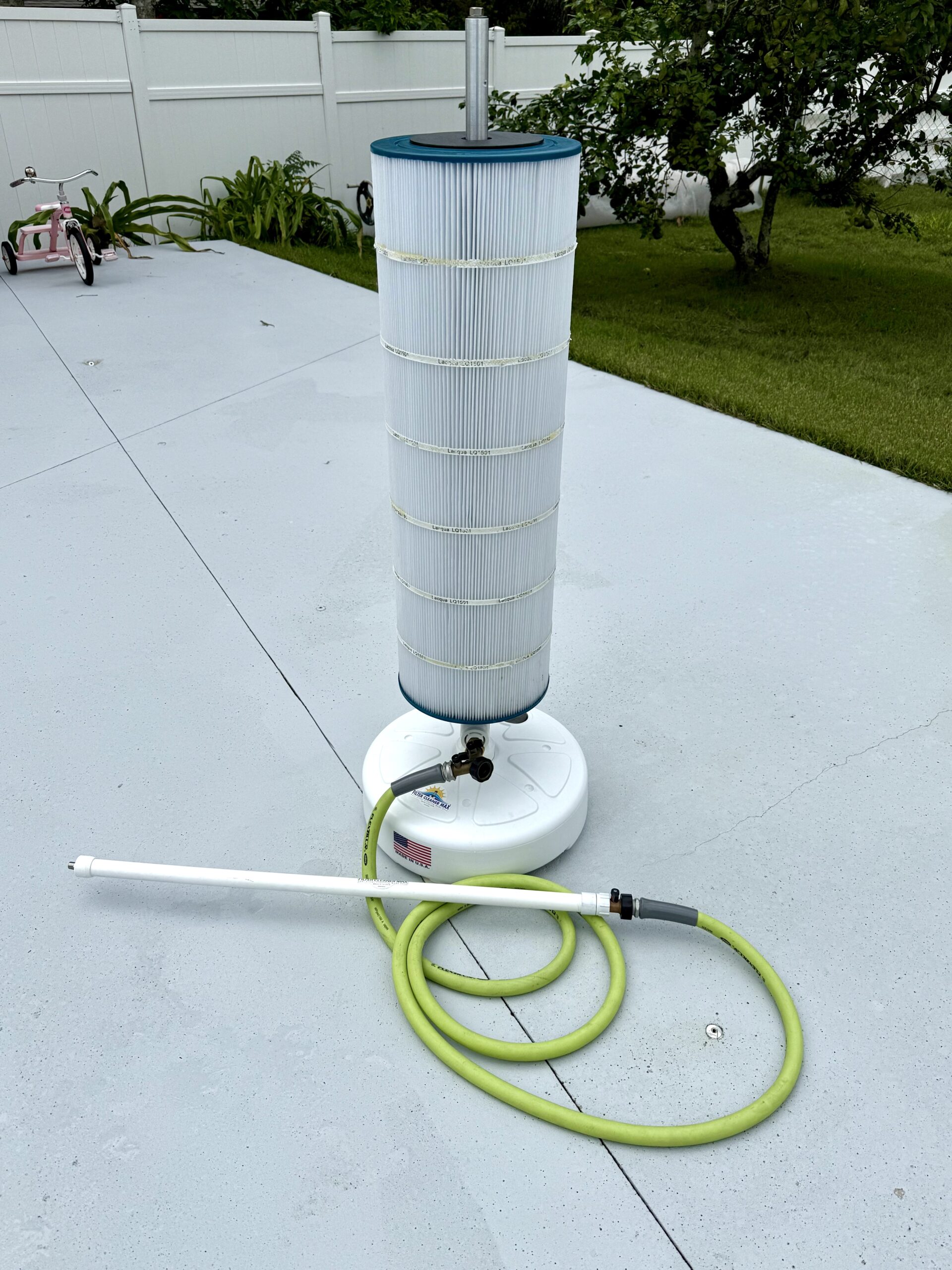Picture of the best pool filter cleaner on concrete patio
