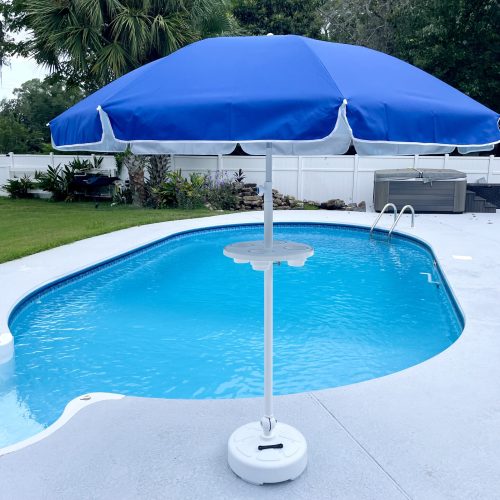 Photo of umbrella table for use in a swimming pool white color with blue umbrella